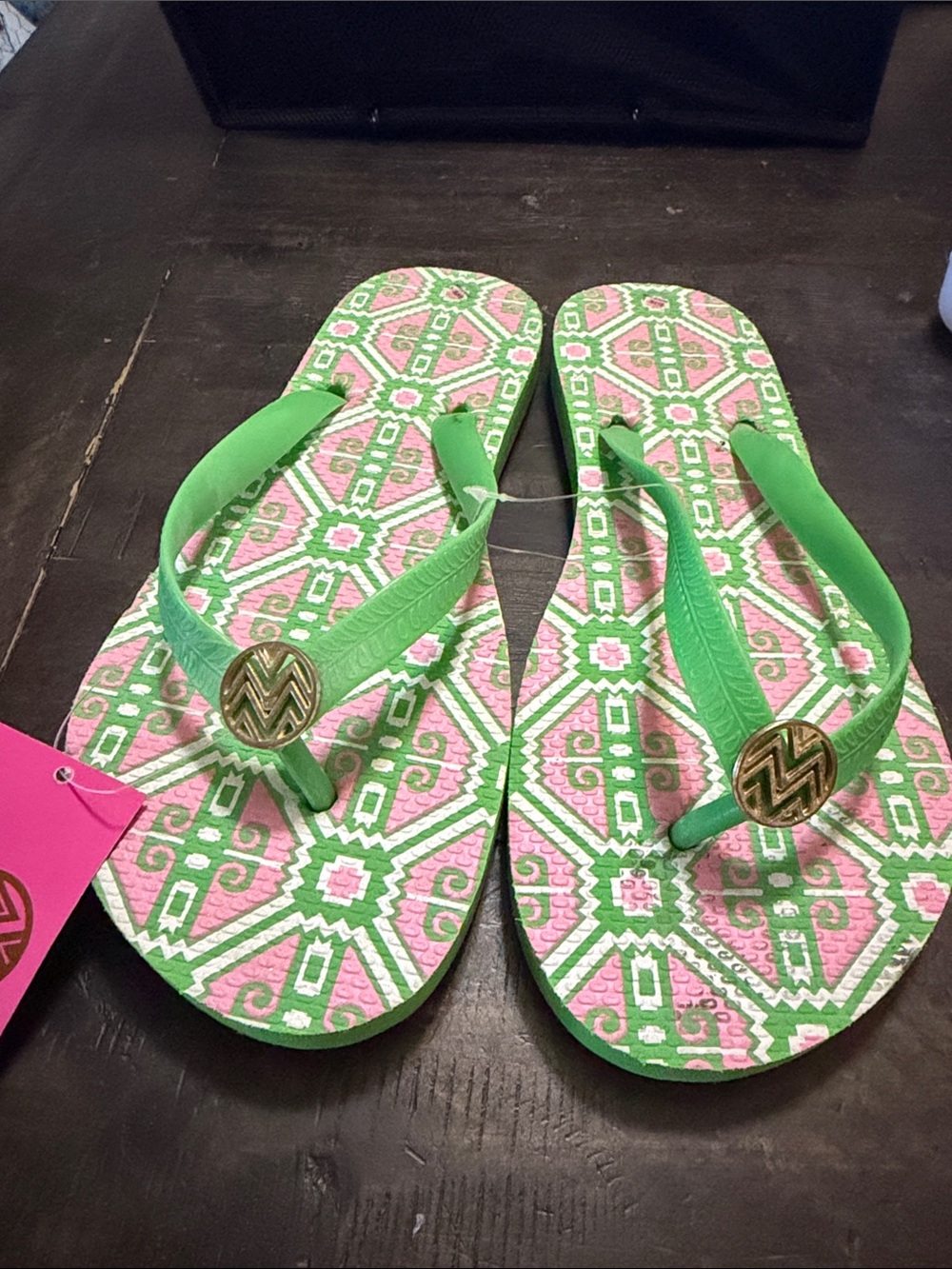 Green and Pink Patterned Flip Flops with Gold Emblem